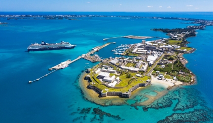 A Celebrity cruise ship sailing toward the Royal Naval Dockyard in Bermuda
