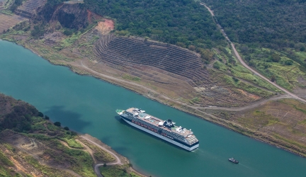 Cruise ship sailing through a canal