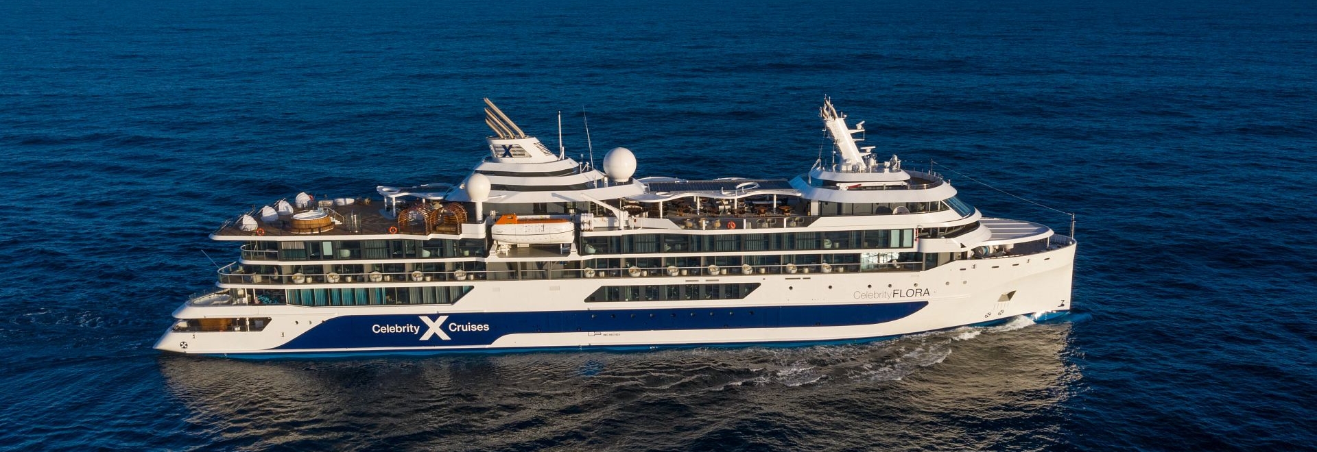 Aerial of the Celebrity Flora sailing on open waters